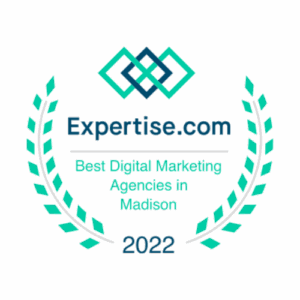A badge from Expertise.com that reads: "Best Digital Marketing Agencies in Madison 2022." The badge, adorned with laurel branches and a geometric logo above the text, epitomizes the prestigious recognition awarded to top agencies.