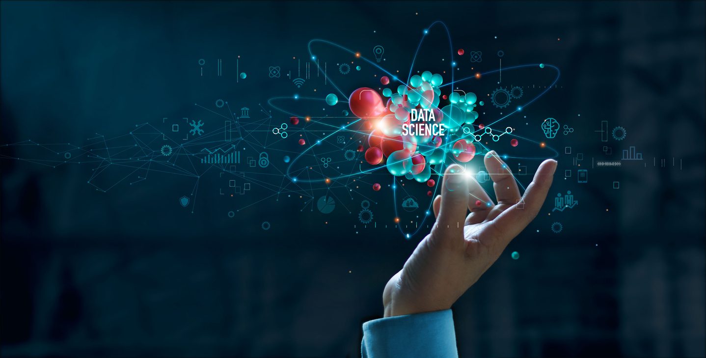 A hand reaching out towards a floating digital representation of atomic structures with interconnected nodes and lines. The words "Data Science" are prominently displayed within the structure, surrounded by technology and data icons, illustrating its impact on small business innovation.