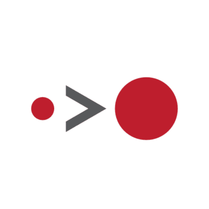 A small red circle is to the left of a gray greater-than symbol, which points towards a larger red circle on the right. The circles and symbol are centered on a plain green background, creating an asymmetric marketing design that might be seen in an innovative marketing agency in Madison, WI.