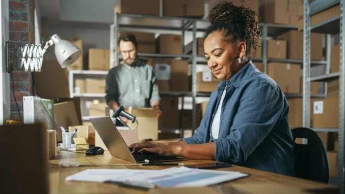 Entrepreneurs working in busy warehouse office to employ the Asymmetric Marketing Engine