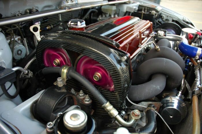 Detailed view of a car engine with colorful components that represents The Asymmetric Marketing Engine