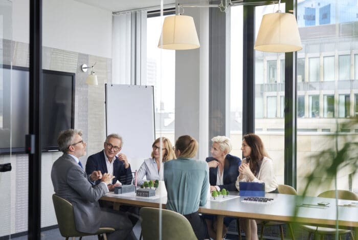 Corporate team discussing in modern office conference room