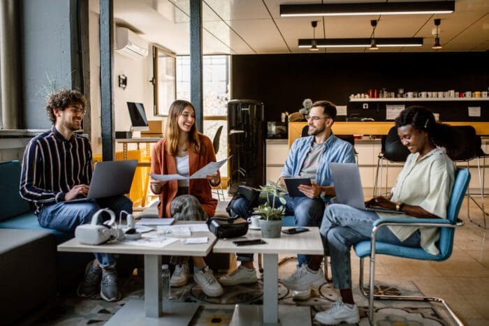 Diverse team collaborating in modern office space