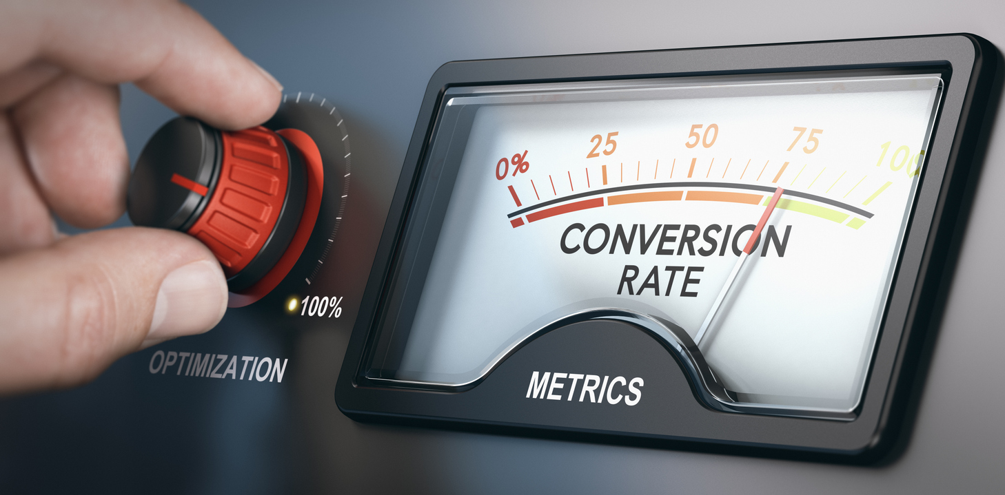 Hand adjusting conversion rate on digital optimization meter to illustrate conversion rate optimization (CRO)