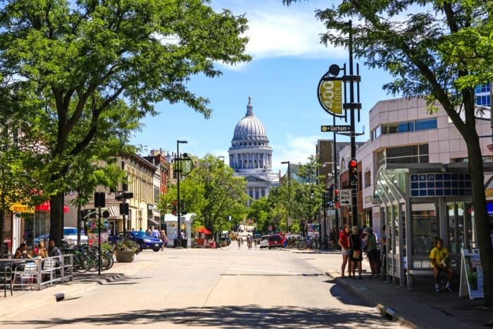 Sunny street view towards domed Capitol building in Madison WI