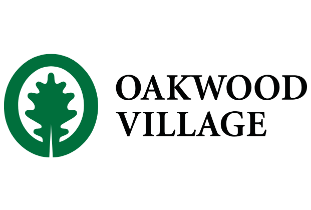 Oakwood Village logo with green tree symbol