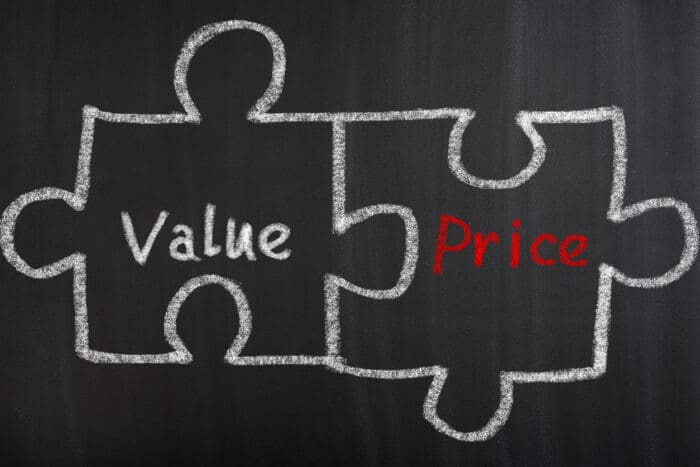 Puzzle pieces representing value and price.