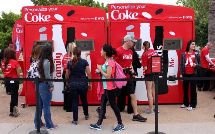People at outdoor Coca-Cola personalized branding event