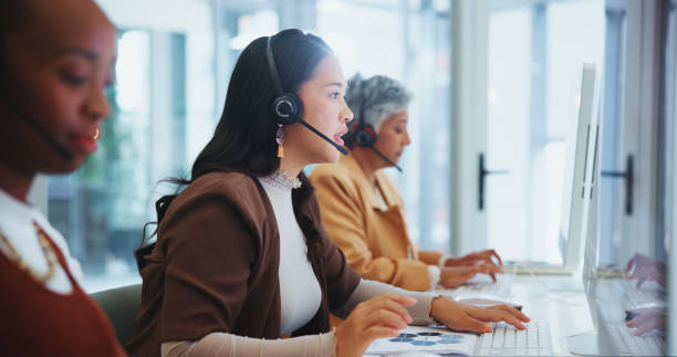Call center team working at computers.